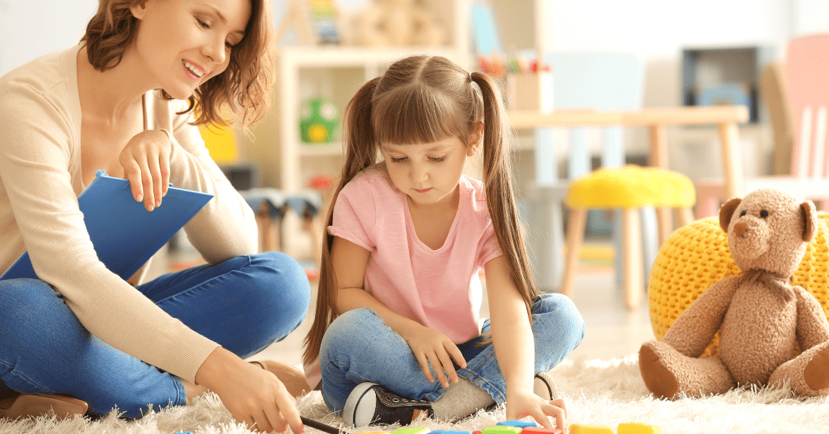 BCBA evaluates autistic girl in ABA therapy