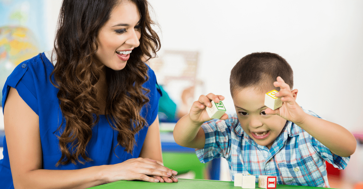 RBT plays with toddler boy in ABA therapy